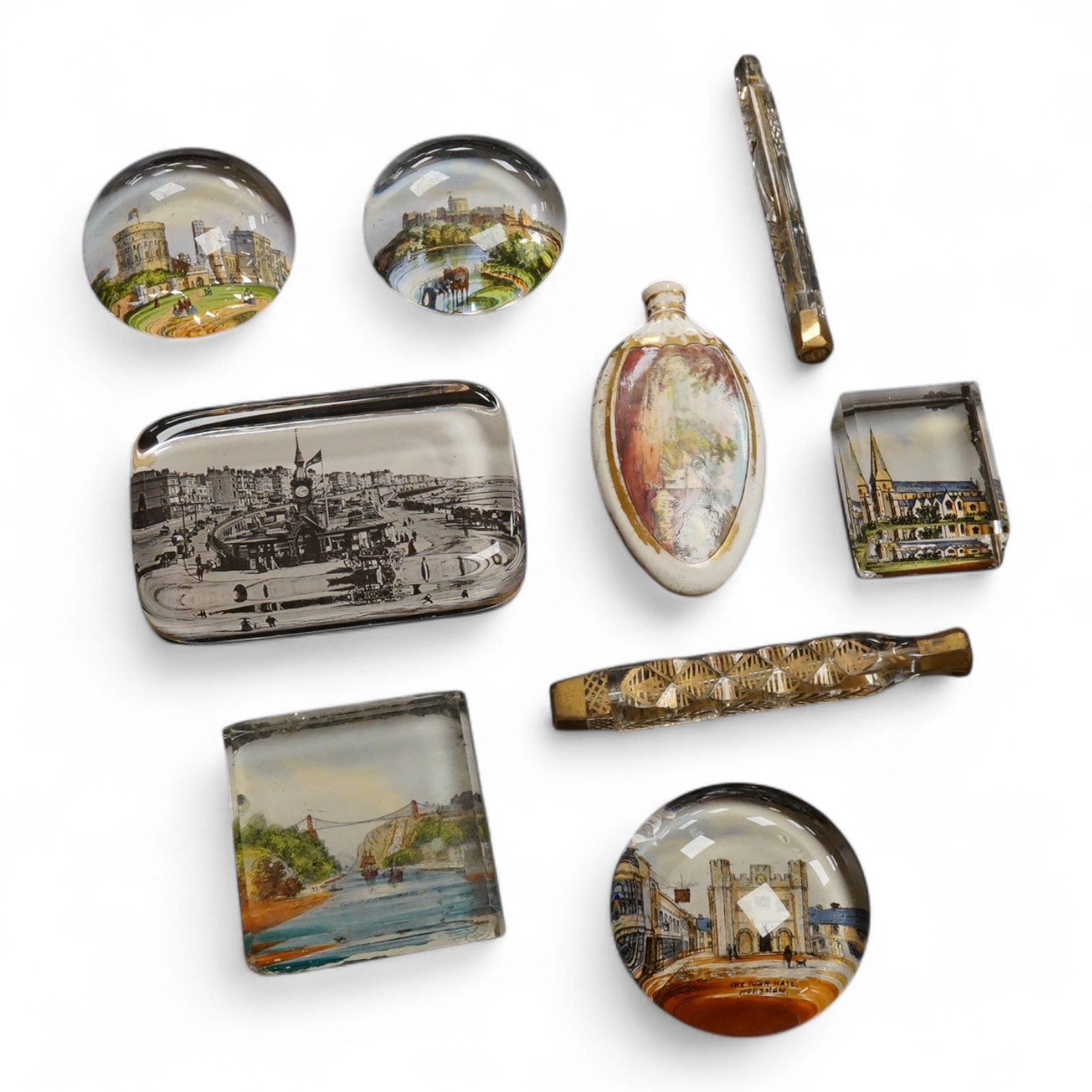Six pictorial glass gem paperweights and three 19th century scent bottles, largest 11cm in length